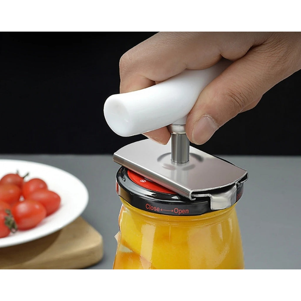 Close view of the curved handle held in one hand over a jar